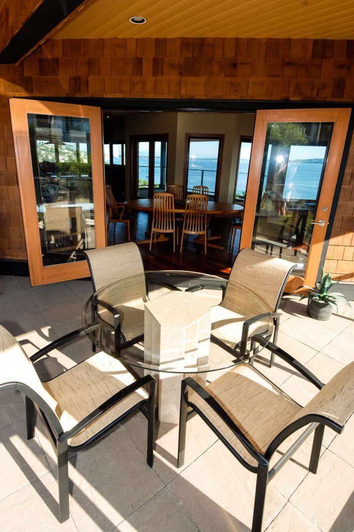 an image of the back patio of sunset view home looking into the dining area as built by surfside construction inc.