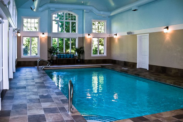 A photo of the interior pool, tile and large windows of the country estate home in surrey bc as built by surfside construction inc.