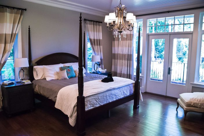 A photo of the country estate master bedroom and four poster bed as built by surfside construction inc.