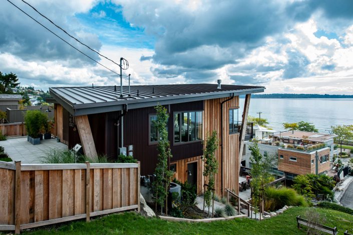 a photograph of the side of the west beach oshaun home looking out over the ocean. built by surfside construction inc.