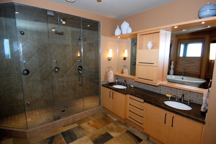 A photo of the master bathroom of a cedar shake hill top estate