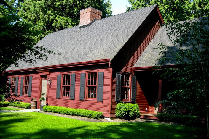 A picture of a Salt Box style home built by Surfside Construction showing the front of the home.