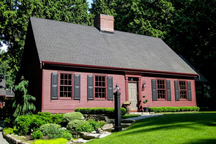 A picture of a Salt Box style home built by Surfside Construction showing the front of the home.