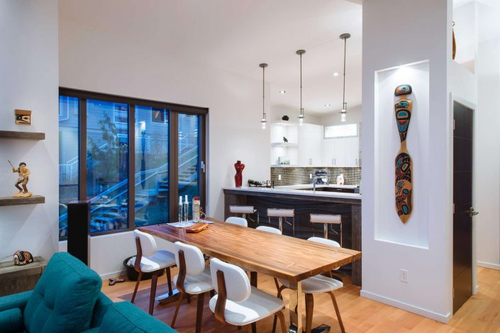 a photograph of the dining room looking back into the Citation Kitchen as built by surfside construction inc.