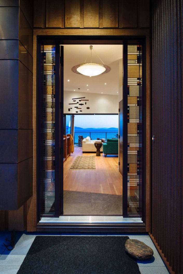 a photograph of the interior of the west beach home as you would see it through the open front door as built by surfside construction inc.