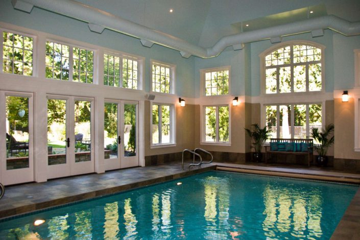 A photograph of the beautiful indoor pool of a Country Estate built by Surfside Construction Inc..