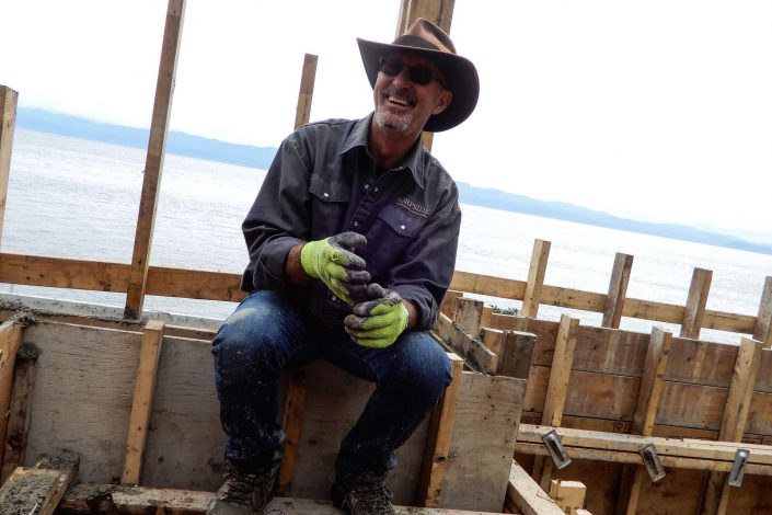 A photo of Owen poppy hard a work on the lighthouse home.