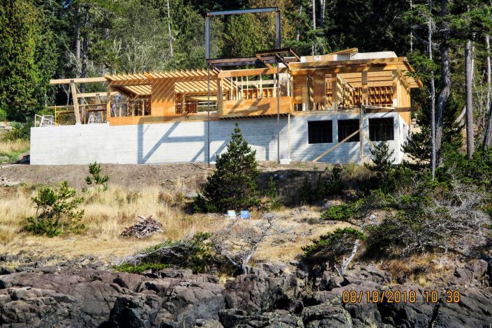 A view of the lighthouse home from the beach as built by surfside construction inc.