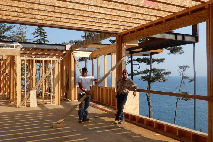 A casual photo of Owen and one of the crew in the lighthouse home in the sooke as built by surfside construction inc.