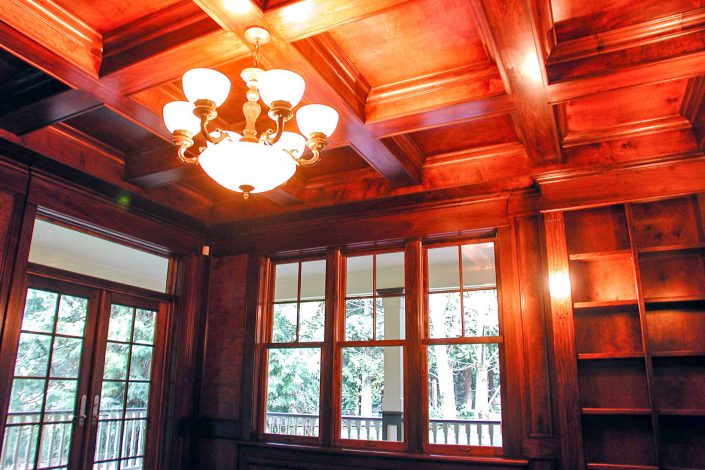 a photo of the wood beam work on the ceiling in the large den of the victorian replica home as built by surfside construction inc.