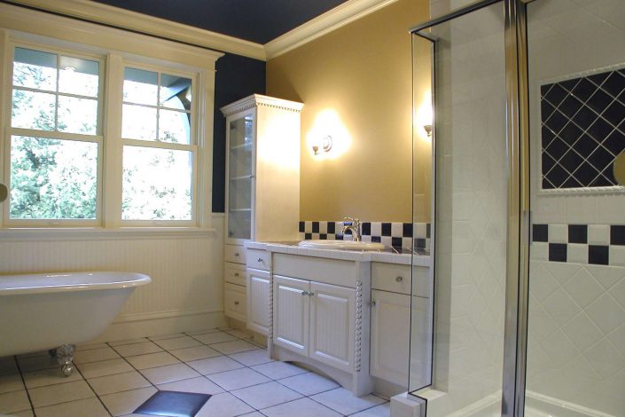 A photo of the ensuite bathroom black and white tile in the victorian replica home as built by surfside construction inc.