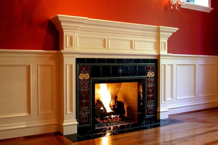 A close up photo of the fireplace of the victorian replica home as built by surfside construction inc.