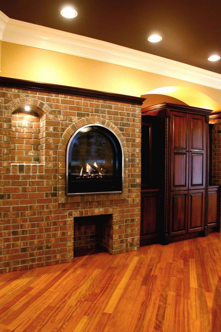a photo of the kitchen fireplace in the Victorian replica home as built by surfside construction inc.