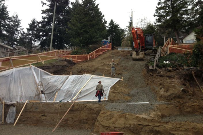 A photo of Owen Poppy and crew preparing for the shot create walls of the west beach home in white rock bc as built by surfside construction inc.