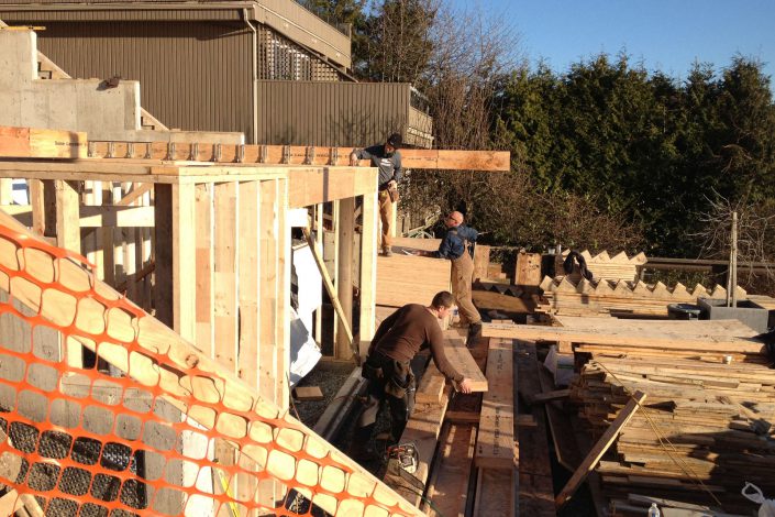 A photo of the crew framing the west beach home in white rock bc as built by surfside construction inc.