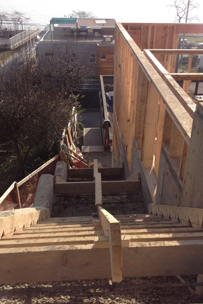 A shot from the top of the exterior staircase showing framing required for the west beach home in white rock bc as built by surfside construction inc.