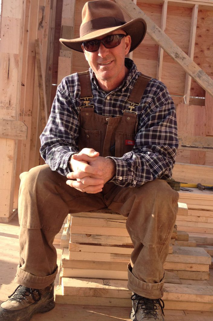 A photo of owner owen poppy taking a break during the framing of the west beach home framing in white rock bc.