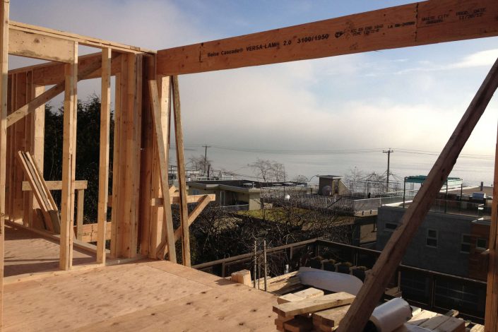 a photo taken from the middle floor of the framing of the west beach home showing the ocean view as built by surfside construction inc.