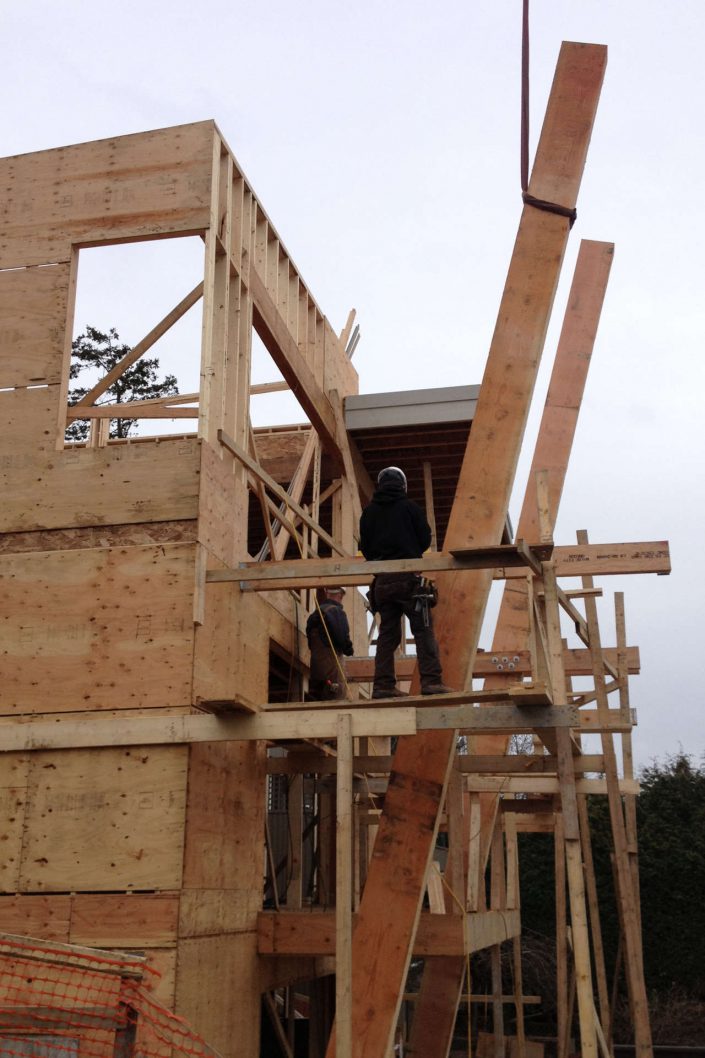 a photo from another angle of the beams being placed in the west beach home as built by surfside construction inc.