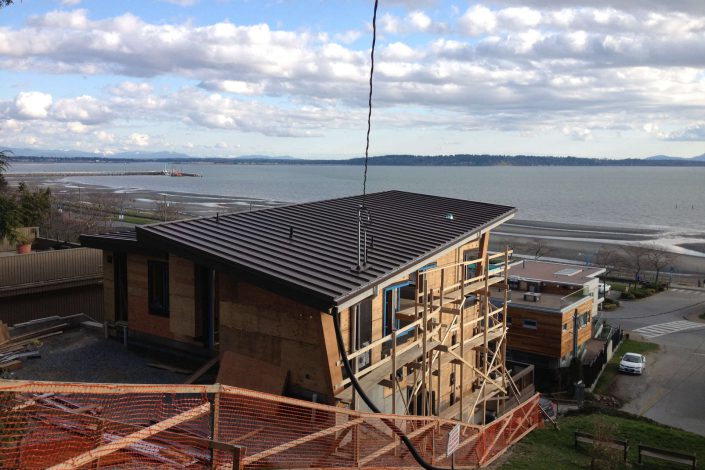 a photo of the west beach home in progress as built by surfside construction inc. looking out over the ocean.