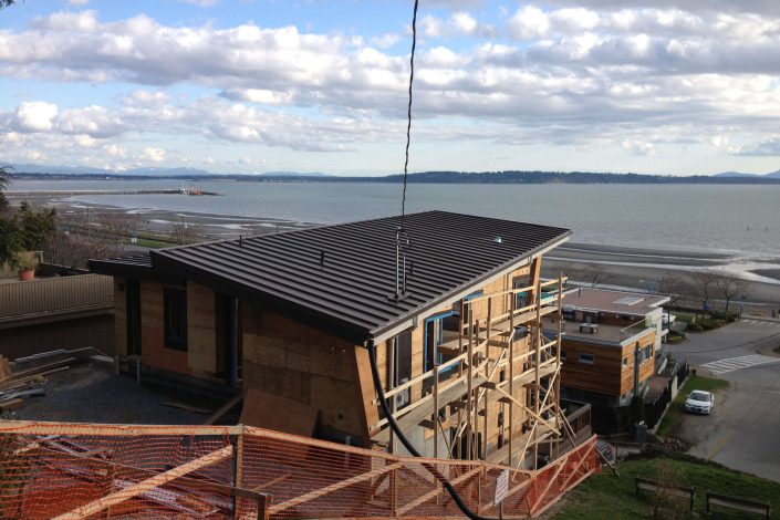 a photo of the west beach home in progress as built by surfside construction inc. looking out over the ocean.