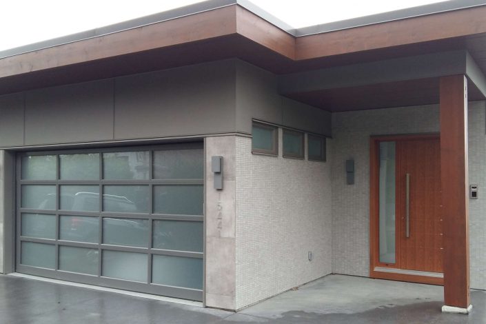 A photo of the hillside modern front door and garage in white rock bc as built by surfside construction inc.