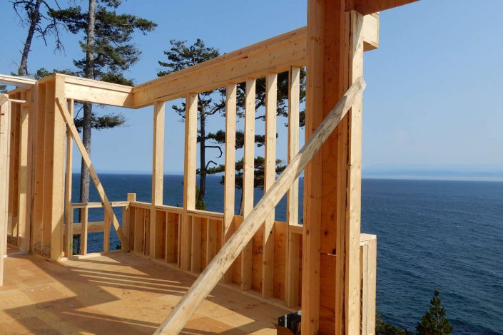 Another view of the ocean through one of the framing openings in the lighthouse home in the sooke bc as built by surfside construction inc.