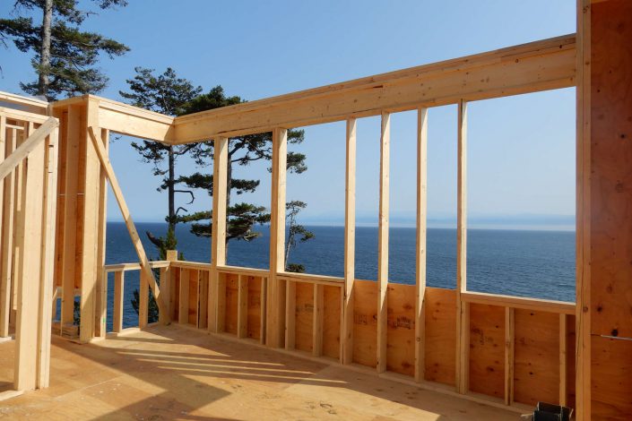 Another view of the lighthouse home framing and view of the ocean in the sooke bc as built by surfside construction inc.
