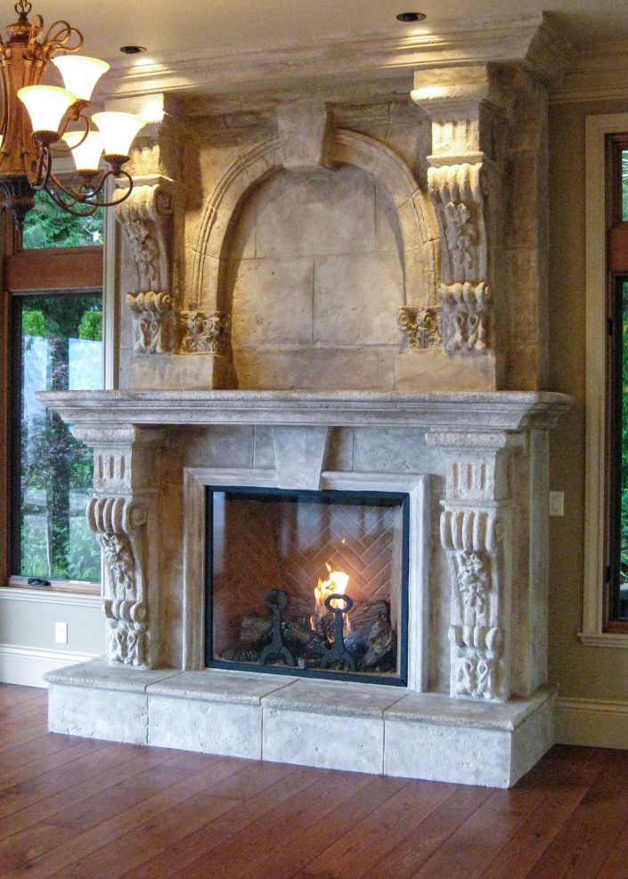 A photo of the lavish marble fireplace in the family room of the crescent bluff home as built by surfside construction inc.