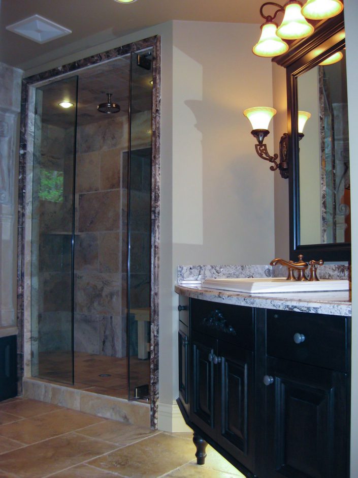a photo of the ensuite shower of the crescent bluff home showing the extensive use of tile. as built by surfside construction inc.