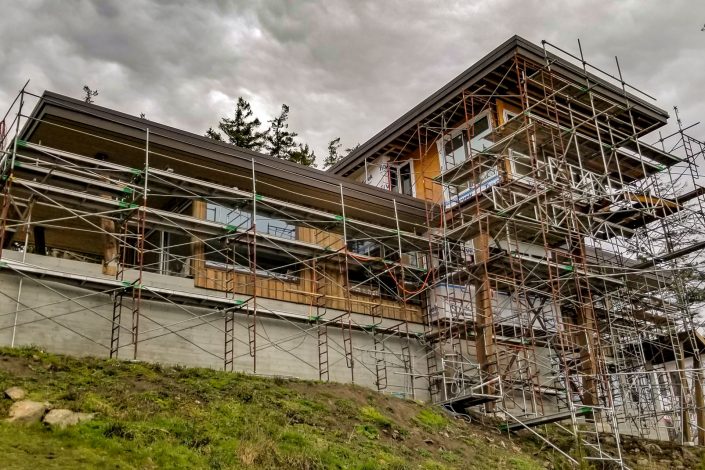A photograph of the scaffolding used on the new home in Shirley BC. Home built by Surfside construction ltd in 2019.