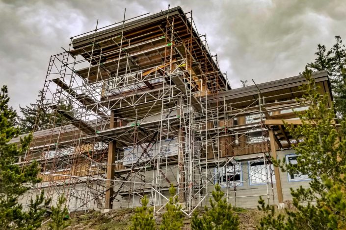 A photograph of the scaffolding used on the new home in Shirley BC. Home built by Surfside construction ltd.